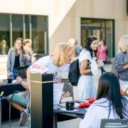 Students around a table at the involvement fair.