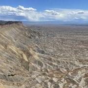 The Bookcliffs line the northern boundary of the Grand Valley, in western Colorado. The high desert region relies on irrigation to enable agriculture.