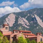 top of a campus building with Flatirons in the background